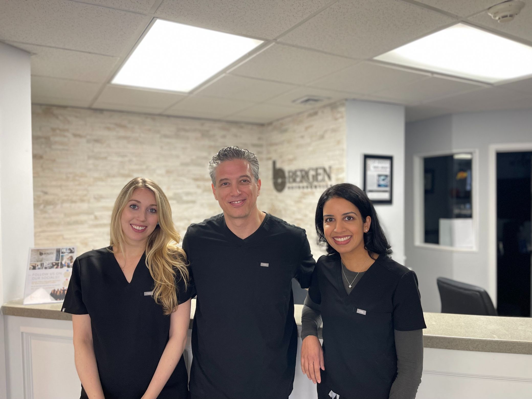 Bergen Orthodontics in front of desk